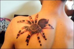 A tattoo on a guy's chest that looks like Spider-Man's suit hiding under his